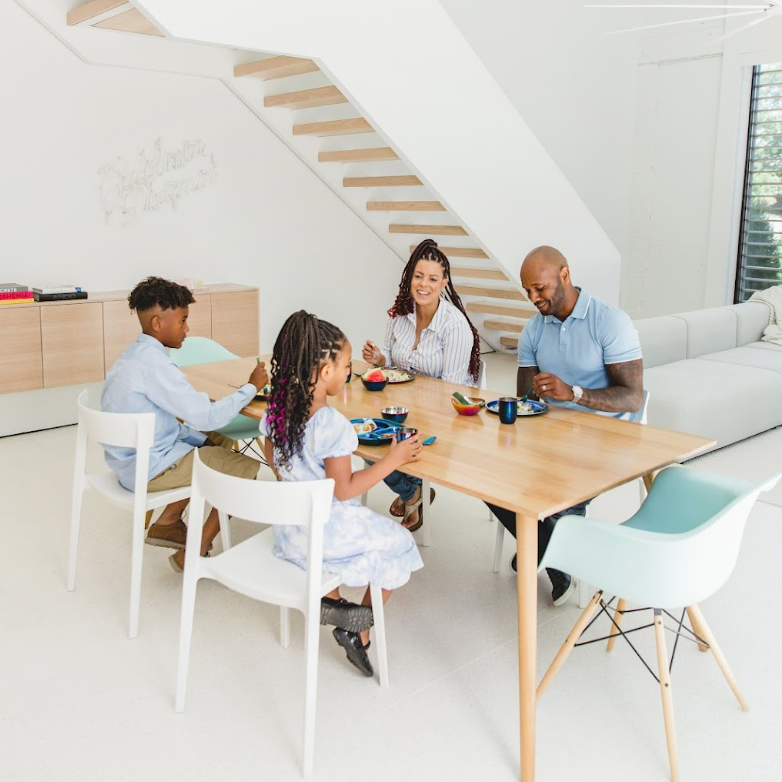 family eating meal with stainless steel dishes