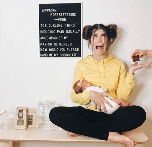 woman breastfeeding and distressed