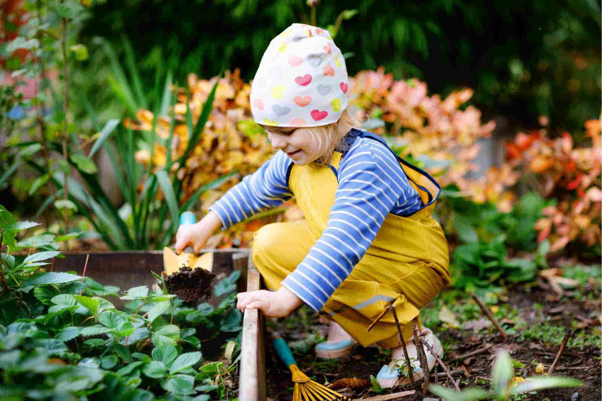 Gardening with Kids | A Child Digging in a Garden