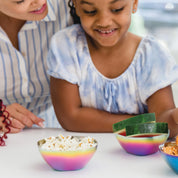 Rainbow stainless steel bowls with fruit and snacks