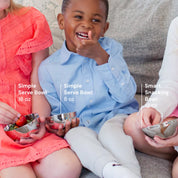 Children holding different sizes of stainless steel bowls in 16 oz, 8 oz, and 12 oz.