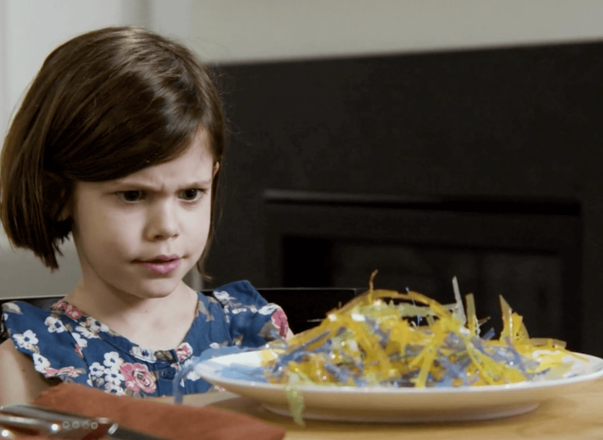 child with plastic on plate