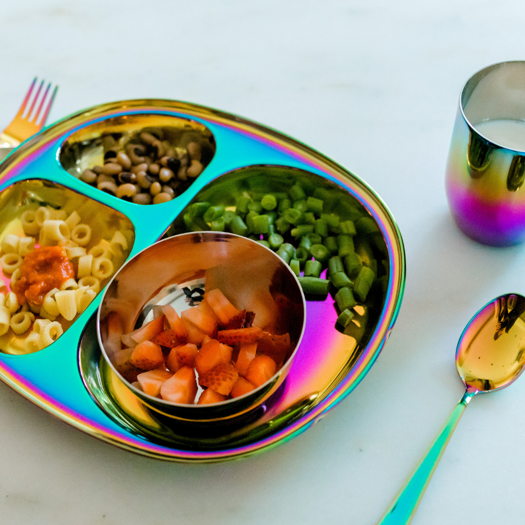 Ahimsa rainbow stainless steel plate with plant- based meal. 