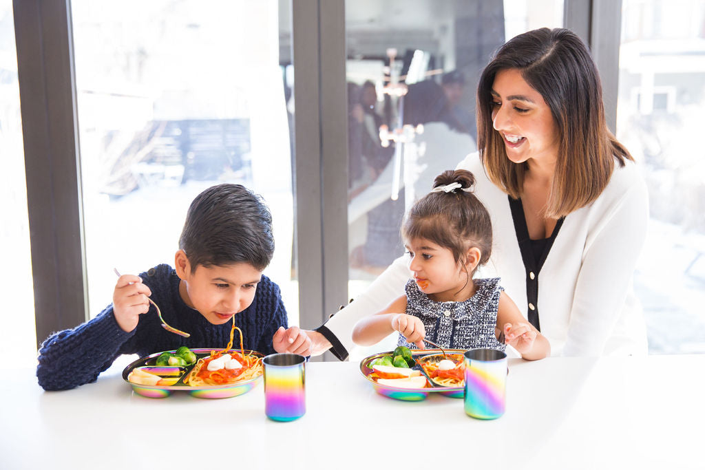 mom with two kids at mealtime with stainless dishes