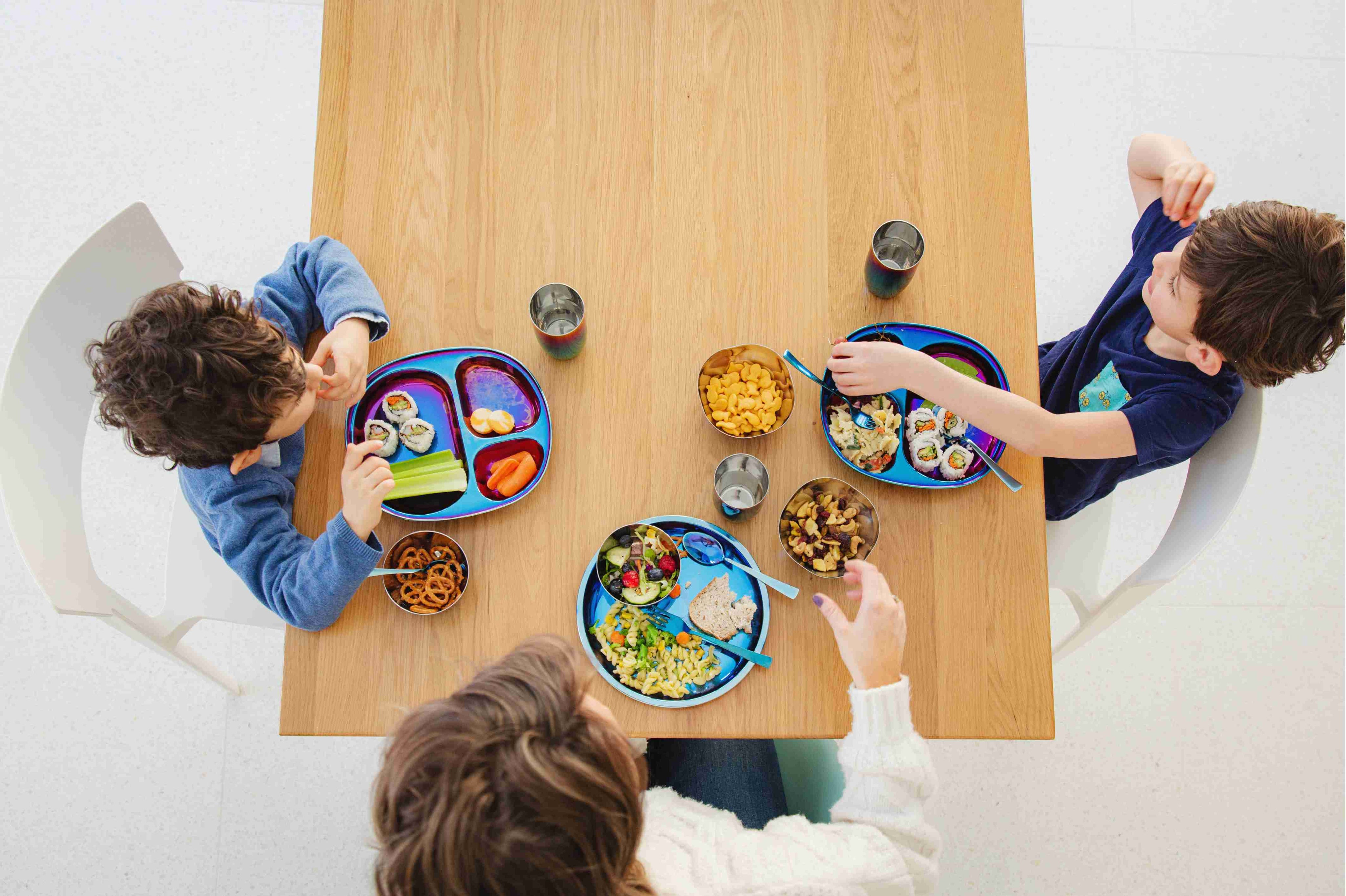 kids eating with stainless steel dishes