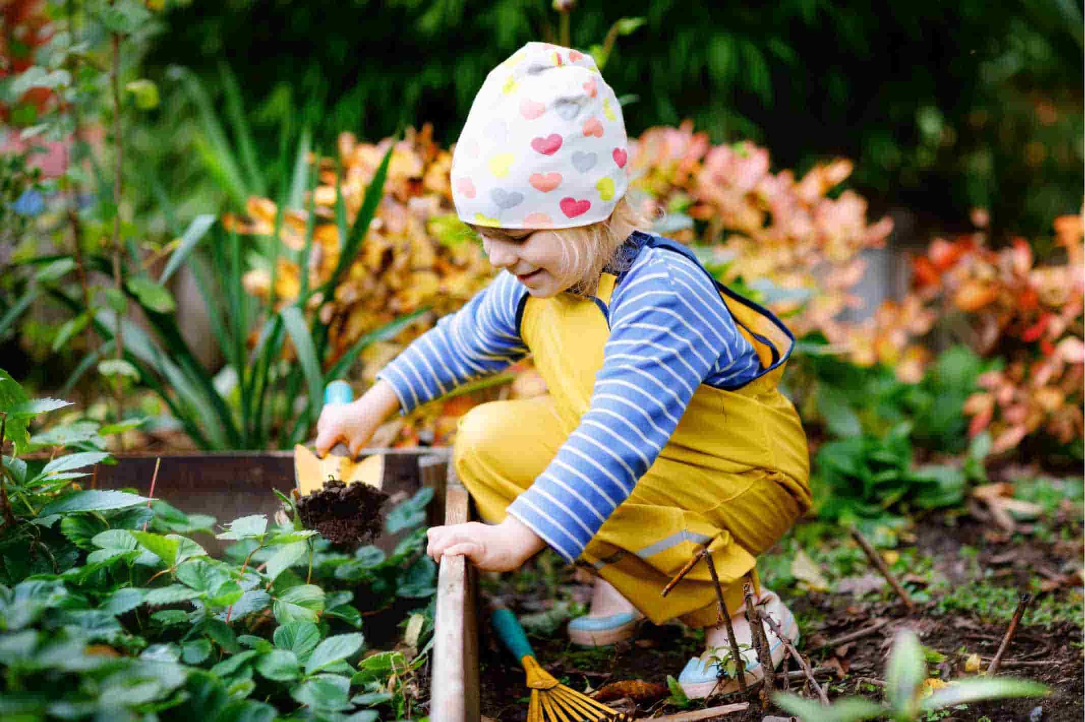 Gardening with Kids | A Child  Digging in a Garden