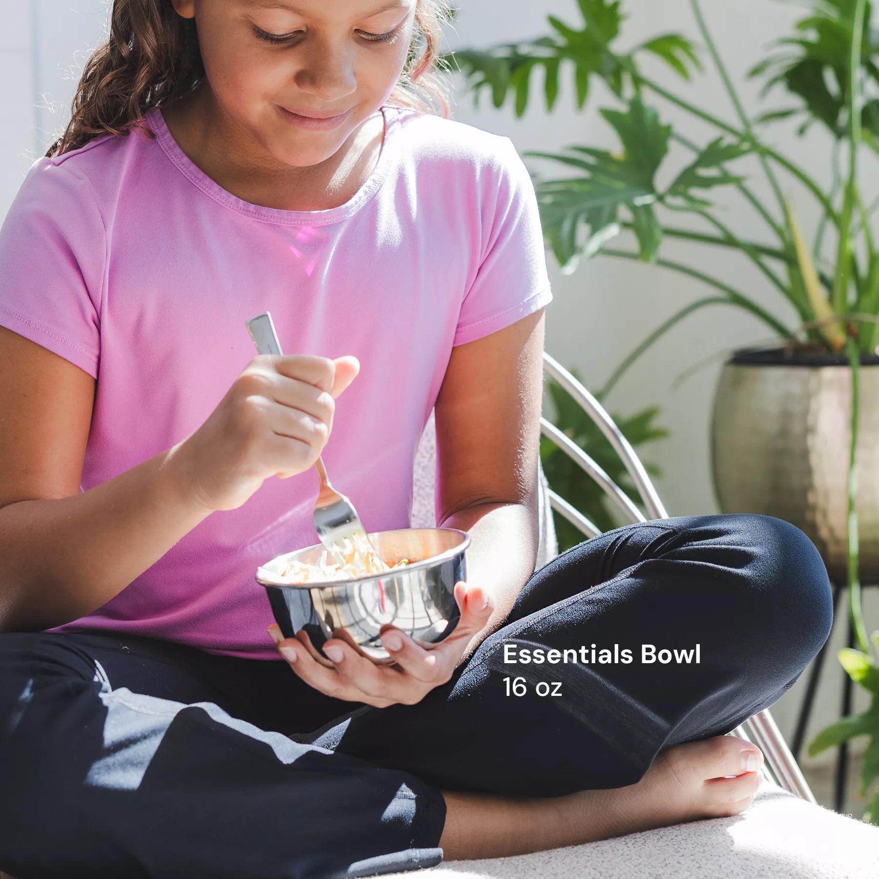 Child eating pasta with fork out of stainless steel 16 ounce bowl - the perfect bowl for eating at home, outside, camping, by the pool, and more
