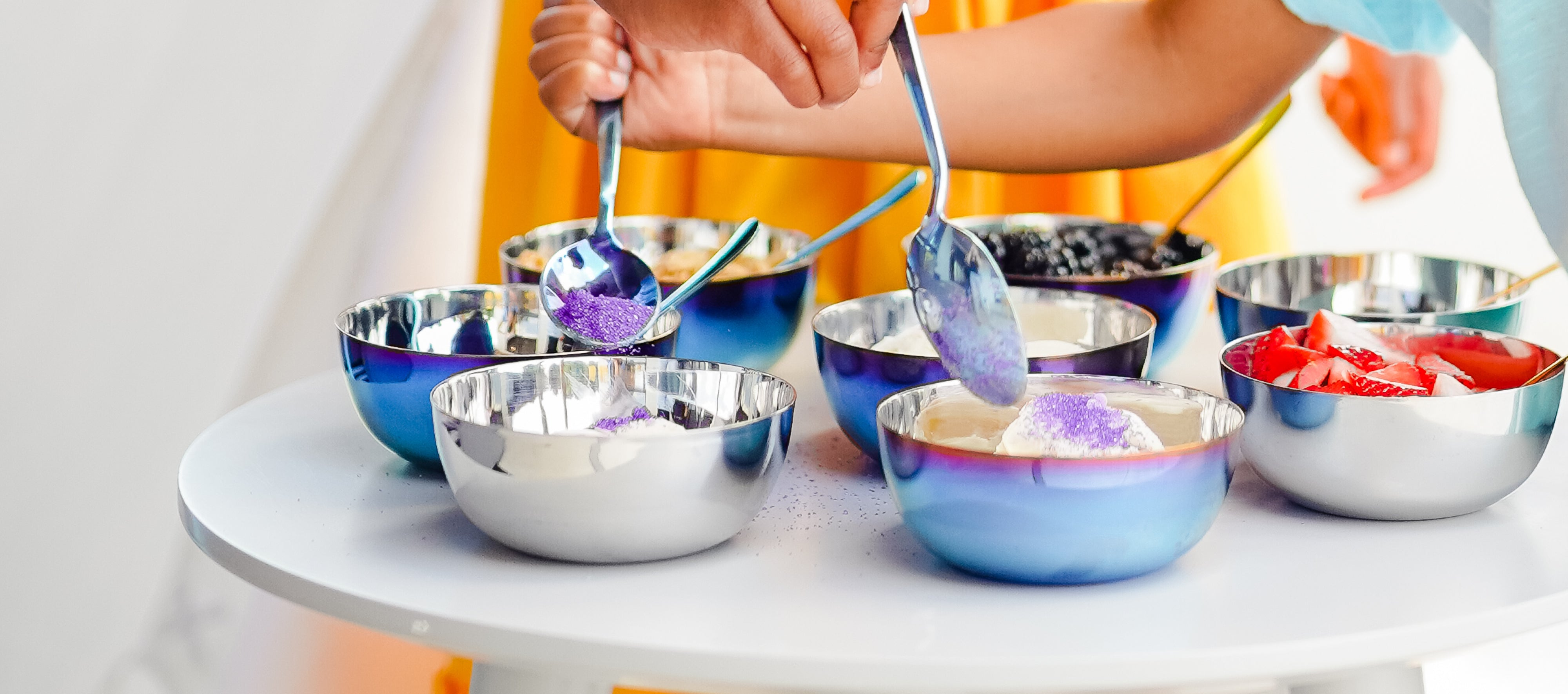 Top your ice cream sundaes with frui, sprinkles, and more with these cute stainless steel 8 ounce round bowls and spoons - the perfect stainless steel dishes for your sundae station.