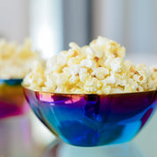 Popcorn snack in blue stainless steel kids bowl