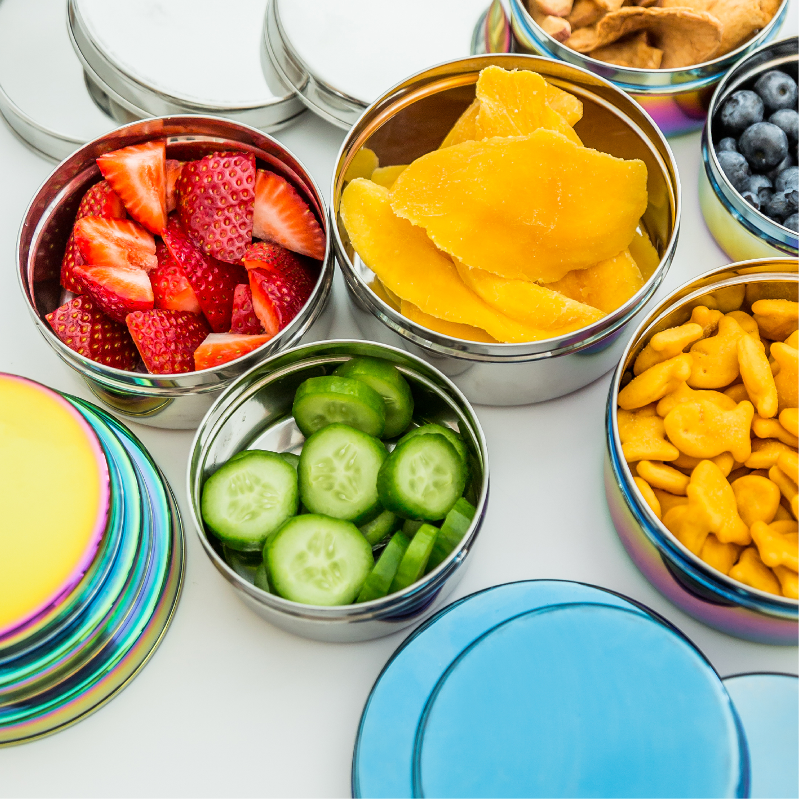 The perfect containers with lids for snacks, lunches, poolside, picnics, sporting events and any on the go occassion.  Pictured in Classic, Rainbow and Iridescent Blue.