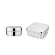 Two silver stainless steel food containers for sandwiches, snacks, fruit, vegetables, pretzels, and more on a white background