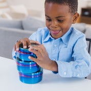 Child stacking  3 blue stainless steel food containers with Smurfs logos etched on the lids