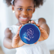 Young girl holding a blue stainless steel food container with Smurfette etched on the lid with The Smurfs logo
