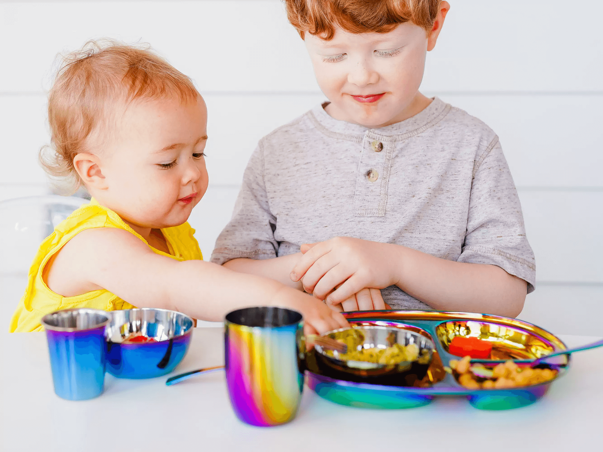 kids eating with stainless steel dishes