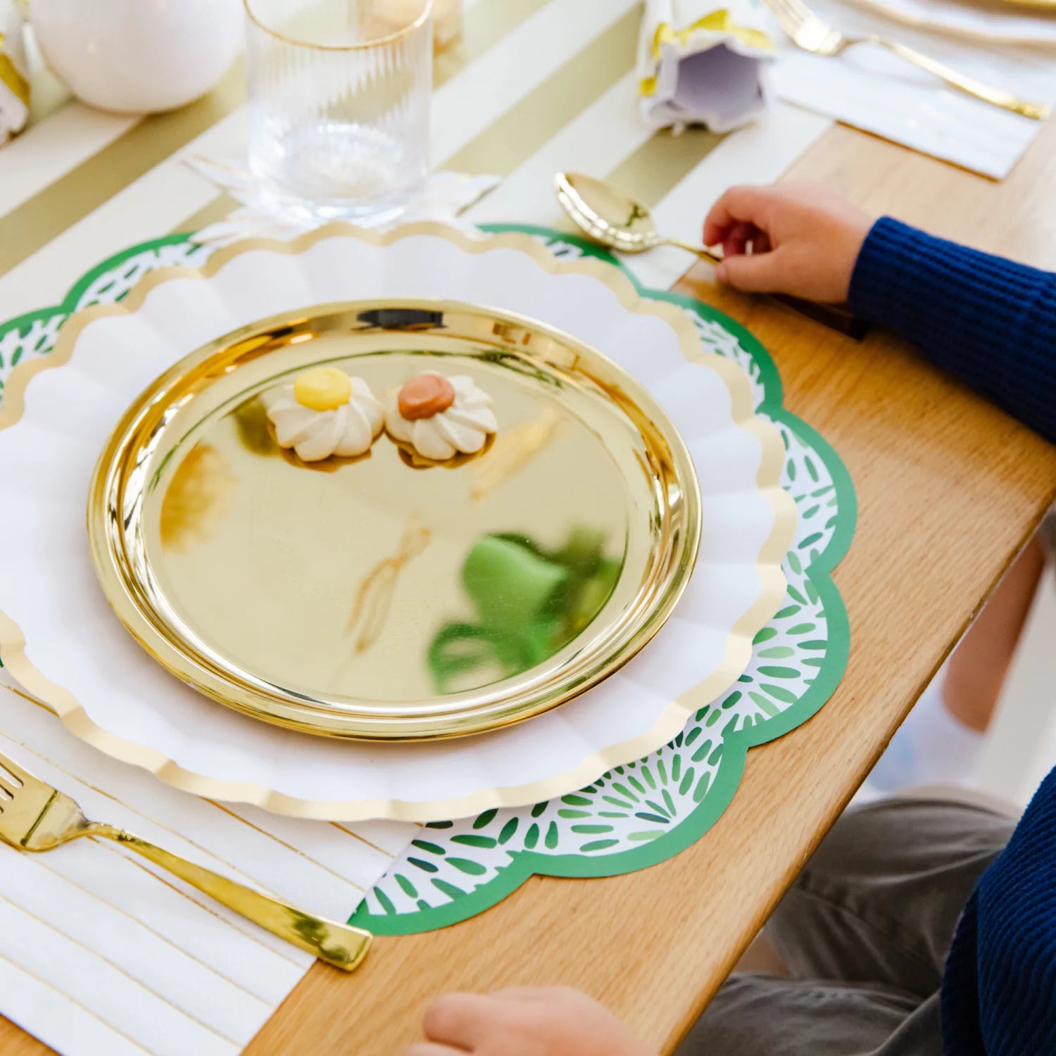 Little hands with Ahimsa spoon and fork in gold with Gold Purposeful Plate