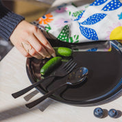 Stainless steel plate with fork and spoon all in graphite or dark gray. Ahimsa's dishes are dishwasher safe, durable, and made of stainless steel - which is a material recommended by the American Academy of Pediatrics as it does not transfer harmful chemicals to kids food, like plastic. 